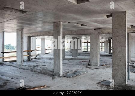 Background image of unfinished building at construction site with concrete columns, copy space Stock Photo
