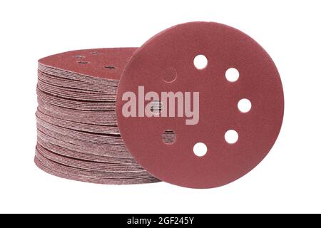 Red round sandpaper disc isolated on a white background. Sanding disk for sander grits. Stock Photo