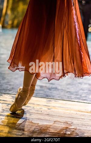 Close up images of ballet shoes and tutu of a dancer stretching before a performance in Saint Petersburg, Russia Stock Photo