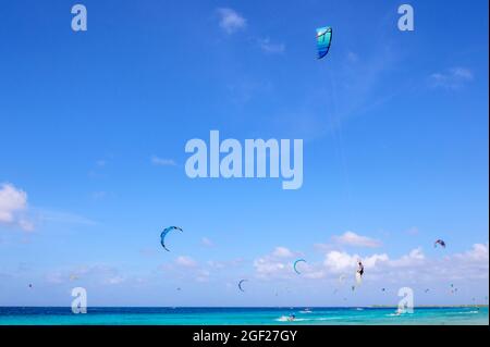 Kite surfing and jumping in the air at Bonaire, Dutch Caribbean. Stock Photo