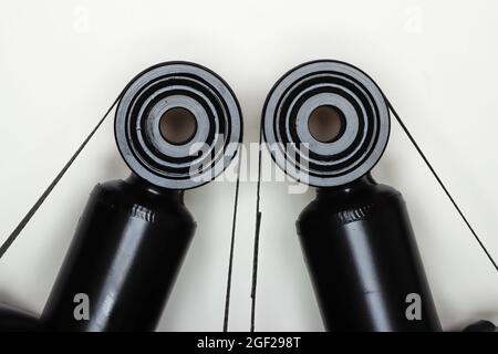 Two silent blocks on shock absorbers, parts for car repair. A set of spare parts for servicing the chassis of the vehicle. Details on white background, copy space available. Stock Photo