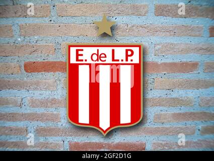 Coat of arms FC Estudiantes de La Plata, Argentine football club, brick background Stock Photo