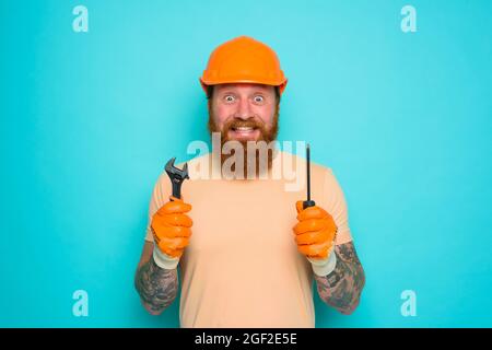 Incompetent worker is unsure and confused about his work Stock Photo