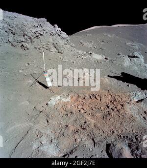 (12 Dec. 1972) --- A view of the area at Station 4 (Shorty Crater) showing the now highly-publicized orange soil which the Apollo 17 crew members found on the moon during the second Apollo 17 extravehicular activity (EVA) at the Taurus-Littrow landing site. The tripod-like object is the gnomon and photometric chart assembly which is used as a photographic reference to establish local vertical sun angle, scale and lunar color. The gnomon is one of the Apollo lunar geology hand tools Stock Photo