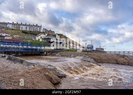 skelton beck in flood at saltburn, north yorkshire, uk Stock Photo