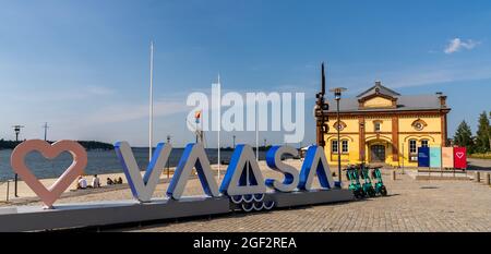 Vaasa, Finland: 28 July, 2021: Vaasa harborfront with the old harbormaster building and the Love Vaasa sign Stock Photo