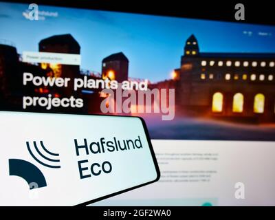 Smartphone with logo of Norwegian power company Hafslund Eco AS on screen in front of business website. Focus on center of phone display. Stock Photo