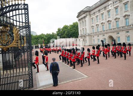 Members of the Nijmegen Company Grenadier Guards and the 1st Battalion the Coldstream Guards take part in the Changing of the Guard, in the forecourt of Buckingham Palace, London, which is taking place for the first time since the start of the coronavirus pandemic. Picture date: Monday August 23, 2021. Stock Photo