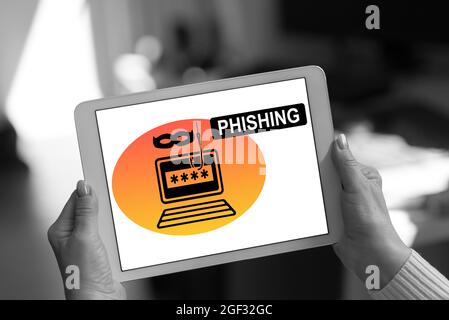 Phishing concept shown on a tablet held by a woman Stock Photo