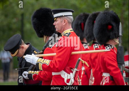 Wellington Barracks, London, UK. 23 August 2021. Preparations at Wellington Barracks for the full ceremonial Changing the Guard with music at Buckingham Palace after the longest pause since WW2 due to the Coronavirus restrictions in March 2020. Number 3 Company from 1st Battalion Coldstream Guards based in Windsor undertake this first full ceremonial duty accompanied by the Band of The Coldstream Guards. Image: Inspection of The Guard at Wellington Barracks before the ceremony. Credit: Malcolm Park/Alamy Live News Stock Photo