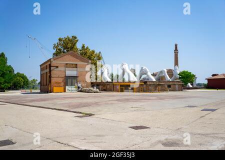 Sculpture 'Building Bridges' by Italian artist Lorenzo Quinn, installed in Venice Arsenale in 2019 Stock Photo