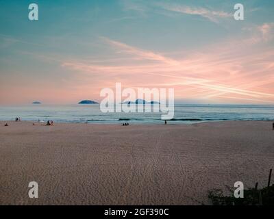 Aerial view of Ipanema beach during sunset, sun with clouds Stock Photo