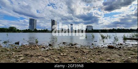 Bonn Germany July 2020 river and skyline against blue sky with dramatic clouds Stock Photo