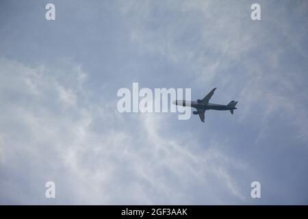 Low angle shot of an airplane flying in the sky of Moscow Stock Photo