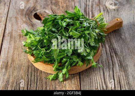 fresh ripe green parsley on wood background Stock Photo