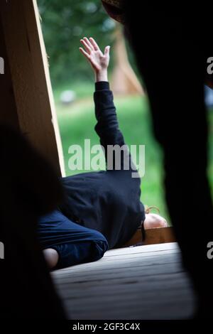solo dancer move laying on the floor in contemporary improvisation performance on nature bg Stock Photo