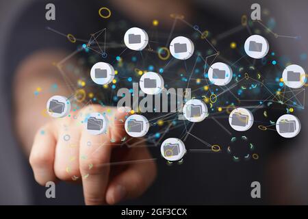 Hand touching a floating 3D cloud computing sign Stock Photo