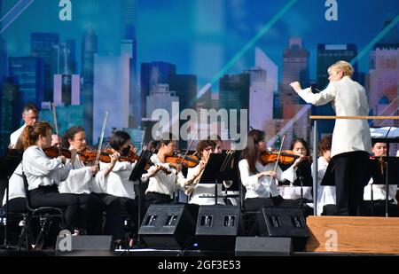 NEW YORK, NEW YORK - AUGUST 21: Marin Alsop conducts the New York Philharmonic at the We Love NYC: The Homecoming Concert at the Great Lawn in Central Park on August 21, 2021 in New York City. We Love NYC:(Photo by John Atashian) Stock Photo