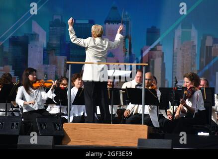 NEW YORK, NEW YORK - AUGUST 21: Marin Alsop conducts the New York Philharmonic at the We Love NYC: The Homecoming Concert at the Great Lawn in Central Park on August 21, 2021 in New York City. We Love NYC:(Photo by John Atashian) Stock Photo