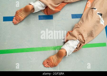 dancers foots, legs, on floor,dacers legs, barefoots in motion near floor on blurred background Stock Photo