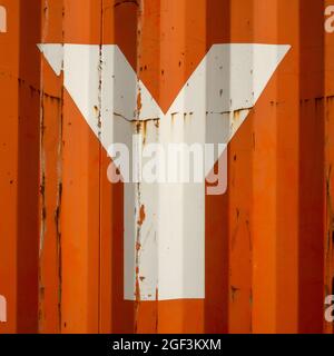 Grunge single letter Y on an orange corrugated enameled metal background Stock Photo