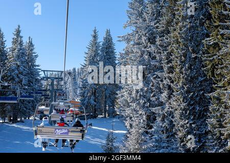 winter scenery, ski lift in the forest, Pamporovo, a famous ski resort, Rodopi mountains, Balkans, Bulgaria Stock Photo