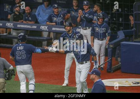 St. Petersburg, FL. USA;  Tampa Bay Rays first baseman Ji-Man Choi (26) is congratulated by teammates Manuel Margot (13) and Kevin Kiermaier (39) afte Stock Photo