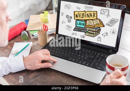Webinar concept shown on a laptop screen Stock Photo