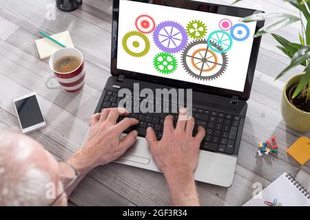 Cooperation concept shown on a laptop used by a man Stock Photo