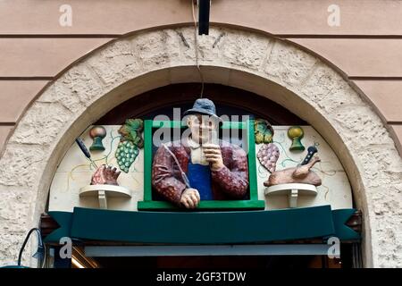 Traditional Viennese restaurant. The most famous schnitzel restaurant in Vienna, Austria. Wall ceramics advertising sign over the entrance. Stock Photo
