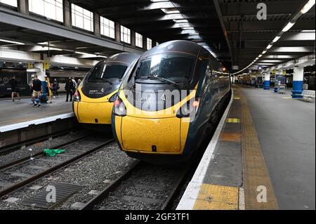 Passengers disembark from trains at Euston station. Stock Photo