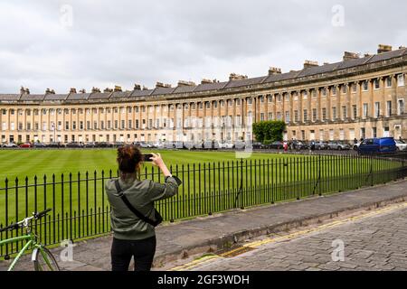 Bath, England - August 2021: Person taking a photograph of the Royal Crescent in Bath Stock Photo