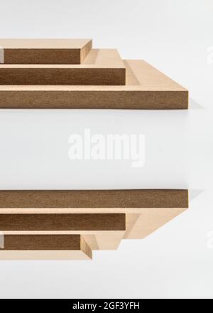 Six MDF boards placed symmetrically, three up and three down. Stock Photo