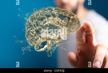 Hand touching a 3D floating human brain - AI concept Stock Photo