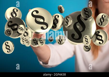 Female's hand touching floating 3D law and justice icons Stock Photo