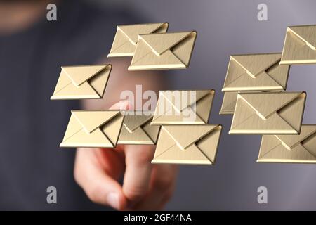Hand touching floating letter icons Stock Photo