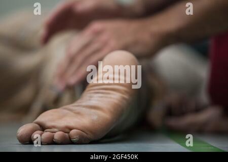 couple dancers contact hands and legs in contact improvisation performance Stock Photo