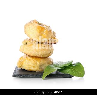 Puff pastry stuffed with spinach on white background Stock Photo
