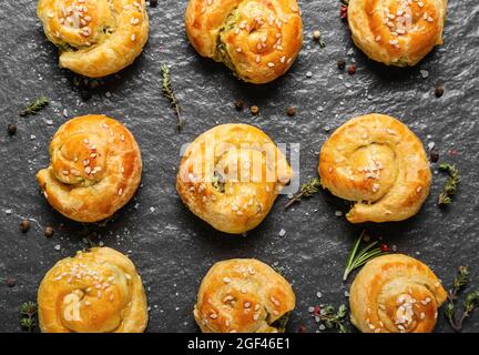 Puff pastry stuffed with spinach on board Stock Photo