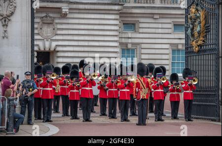 London, UK. 23 August 2021. The full ceremonial Changing the Guard with music at Buckingham Palace after the longest pause since WW2 due to the Coronavirus restrictions in March 2020. Number 3 Company from 1st Battalion Coldstream Guards undertake this first full ceremonial duty. Image shows the Old Guard leaving Buckingham Palace. Credit: Malcolm Park/Alamy Stock Photo