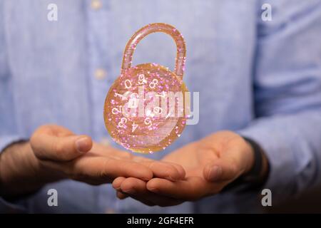 Man holding the virtual 3D padlock icon symbolizing data security Stock Photo