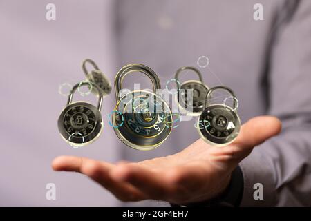 Man holding the virtual 3D padlock icons symbolizing data security Stock Photo