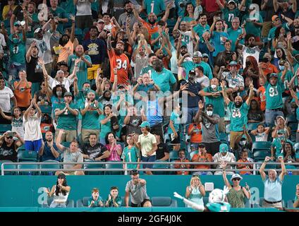 Miami Gardens, United States. 21st Aug, 2021. Miami Dolphins fans celebrate a touchdown against the Atlanta Falcons in a preseason game at Hard Rock Stadium in Miami Gardens, Florida, on Saturday, Aug. 21, 2021. The Dolphins won, 37-17. (Photo by Michael Laughlin/South Florida Sun Sentinel/TNS/Sipa USA) Credit: Sipa USA/Alamy Live News Stock Photo