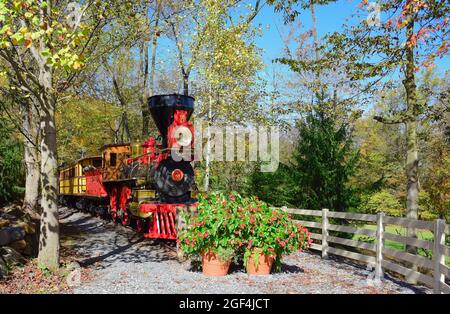 View of Antique Wood Burning Steam Engine and Coaches on a Beautiful Day Stock Photo