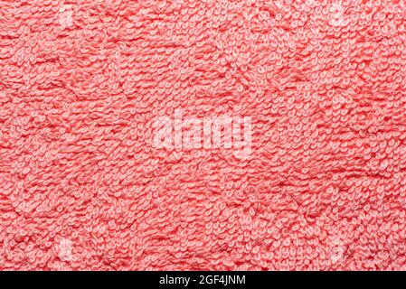 Textile. The texture is pink with straight lines and weave. Close-up of household towel material Stock Photo