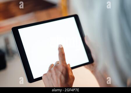 Businesswoman using digital tablet at office Stock Photo