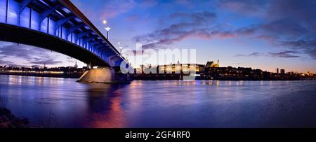 Poland, Masovian Voivodeship, Warsaw, Panoramic view of bridge stretching over Vistula river at Stock Photo