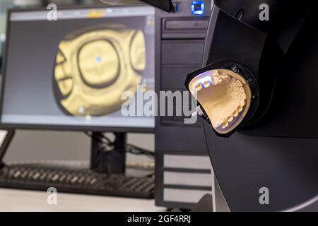 CAD CAM equipment modern extraoral laboratory dental scanner. Selective focus. Stock Photo