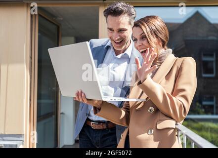 Male and female professionals smiling Stock Photo