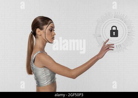 Robot young woman touching lock icon against white background Stock Photo